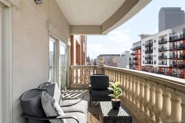 a view of a balcony with chairs