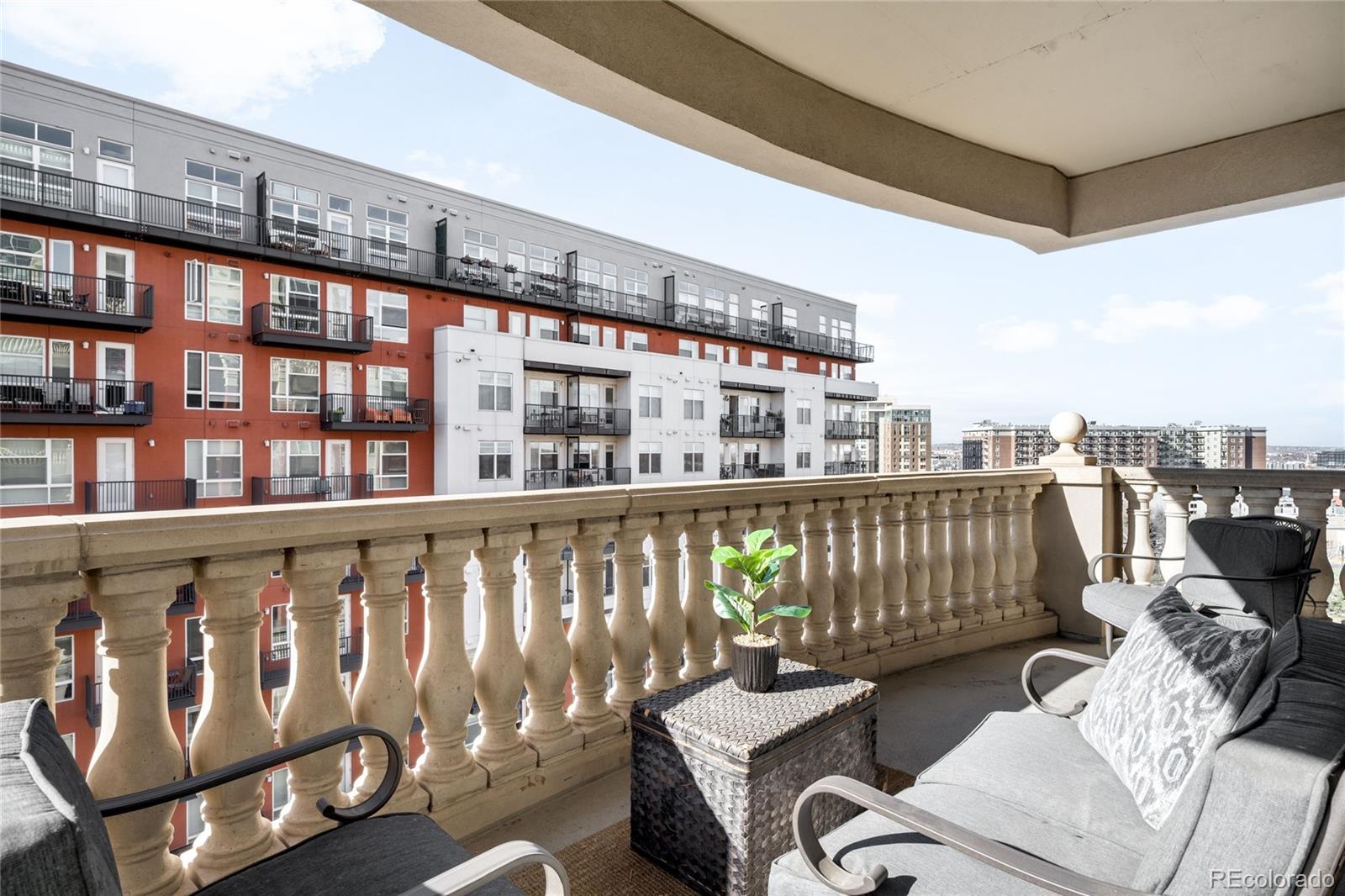 1950 Logan Street, Unit 901 Denver, CO 80203 - Photo 22 of 24 a balcony with furniture and book floor