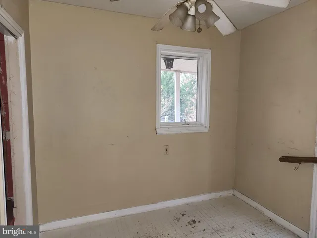 a kitchen with a refrigerator and a stove