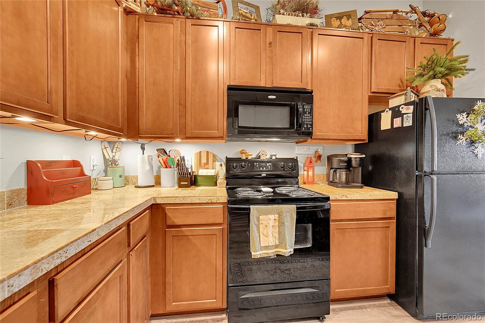 150 Village Road, Unit A302 Granby, CO 80446 - Photo 11 of 50 a kitchen with stainless steel appliances granite countertop a refrigerator stove and sink