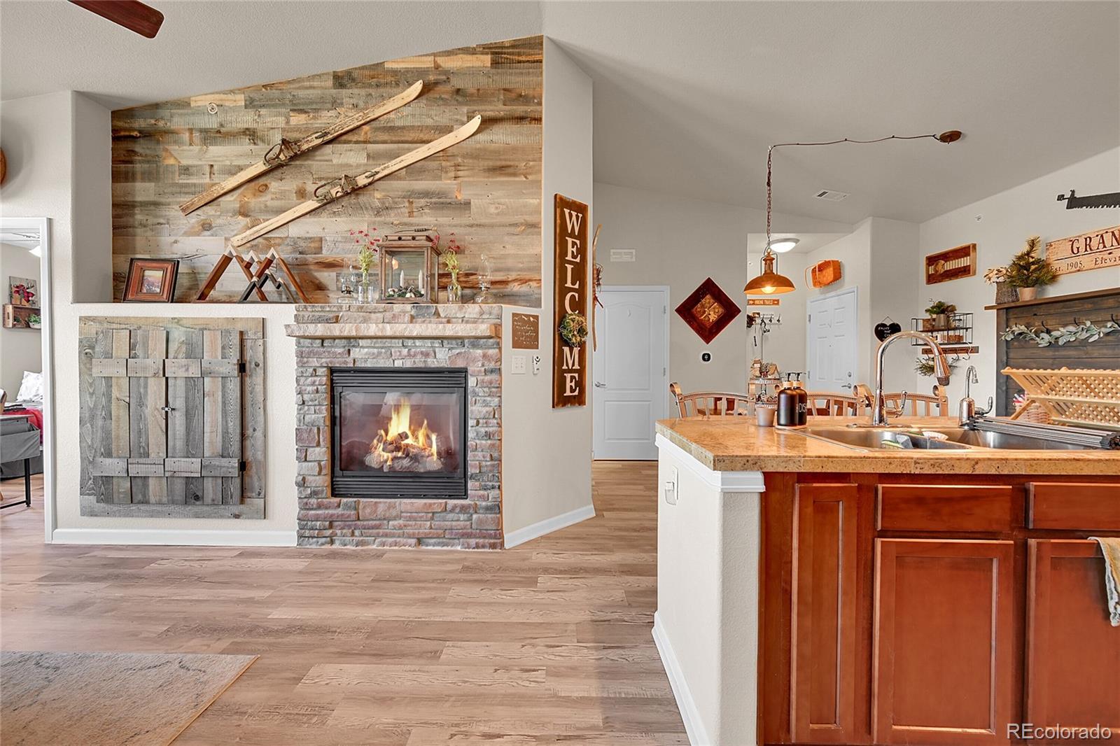 150 Village Road, Unit A302 Granby, CO 80446 - Photo 16 of 50 a view of living room with granite countertop furniture and fireplace