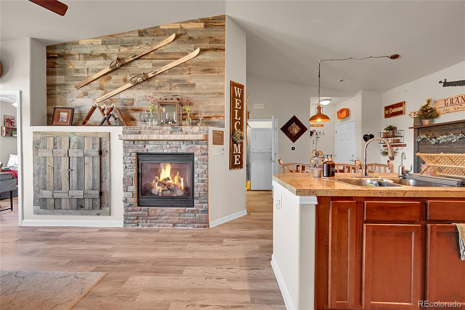 150 Village Road, Unit A302 Granby, CO 80446 - Photo 17 of 50 a view of living room with granite countertop furniture and fireplace