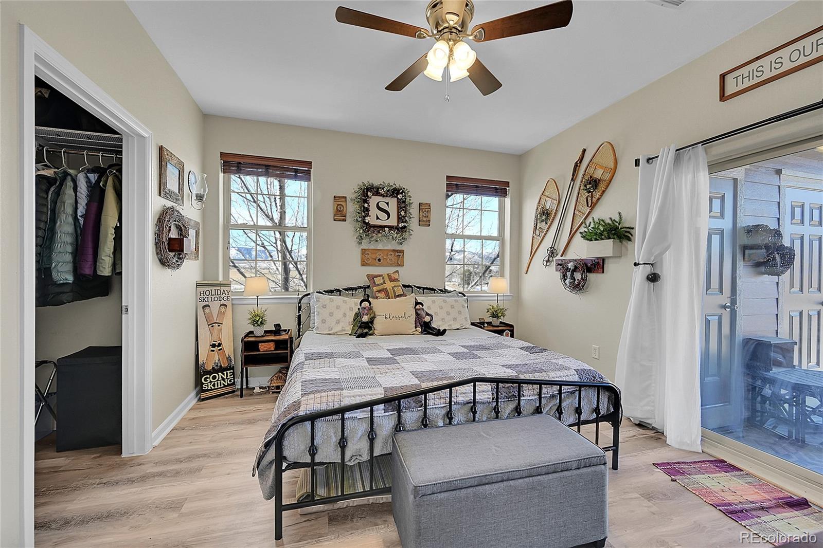 150 Village Road, Unit A302 Granby, CO 80446 - Photo 19 of 50 a bedroom with a bed and wooden floor