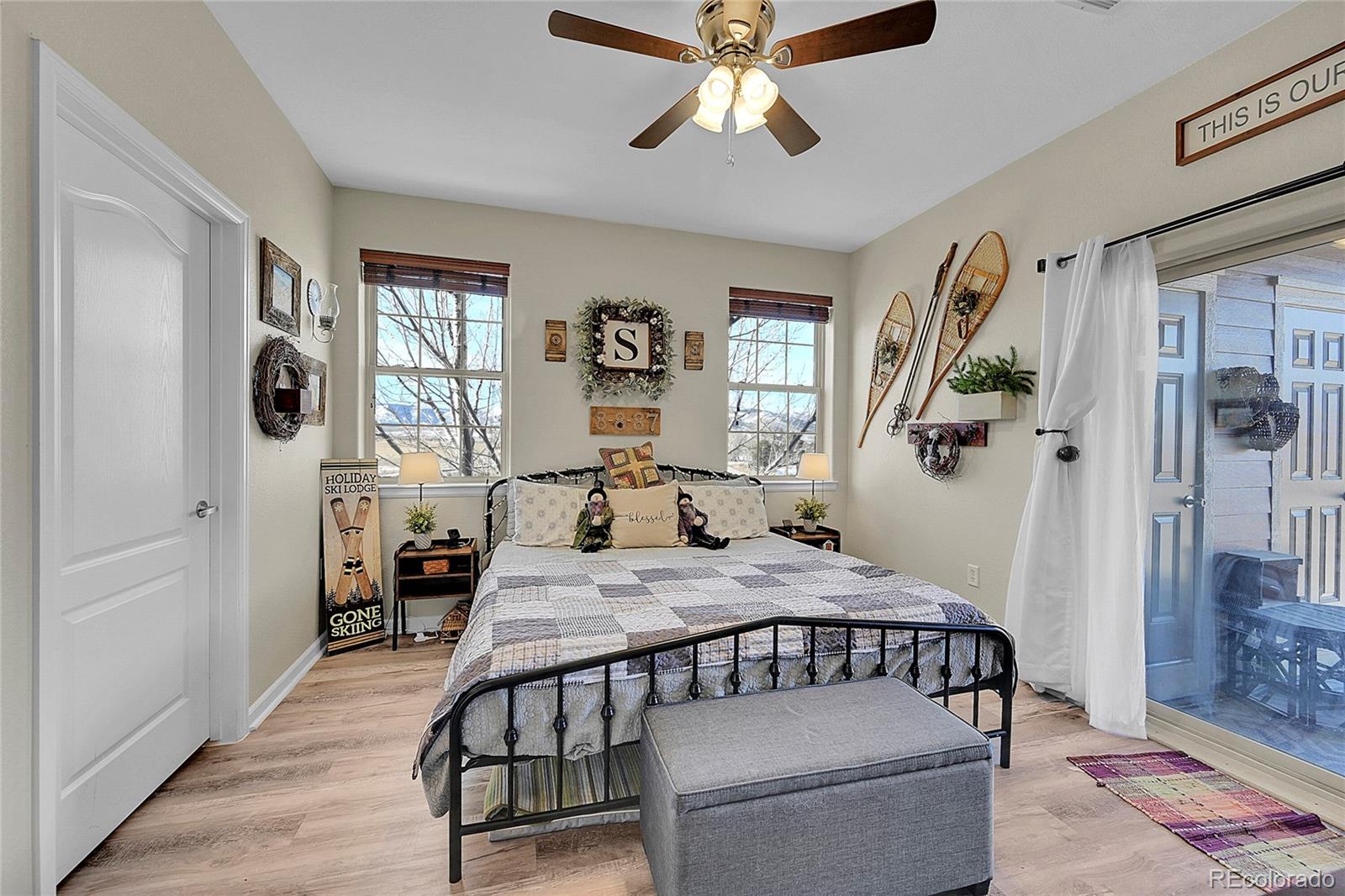 150 Village Road, Unit A302 Granby, CO 80446 - Photo 20 of 50 a bedroom with a bed and wooden floor