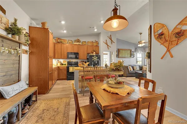 a view of a dining room with furniture and wooden floor