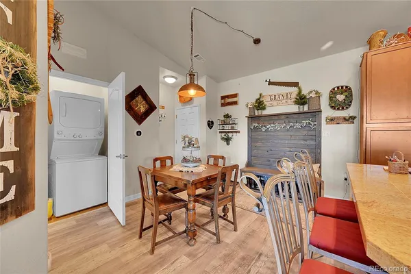 a view of a dining room with furniture and wooden floor