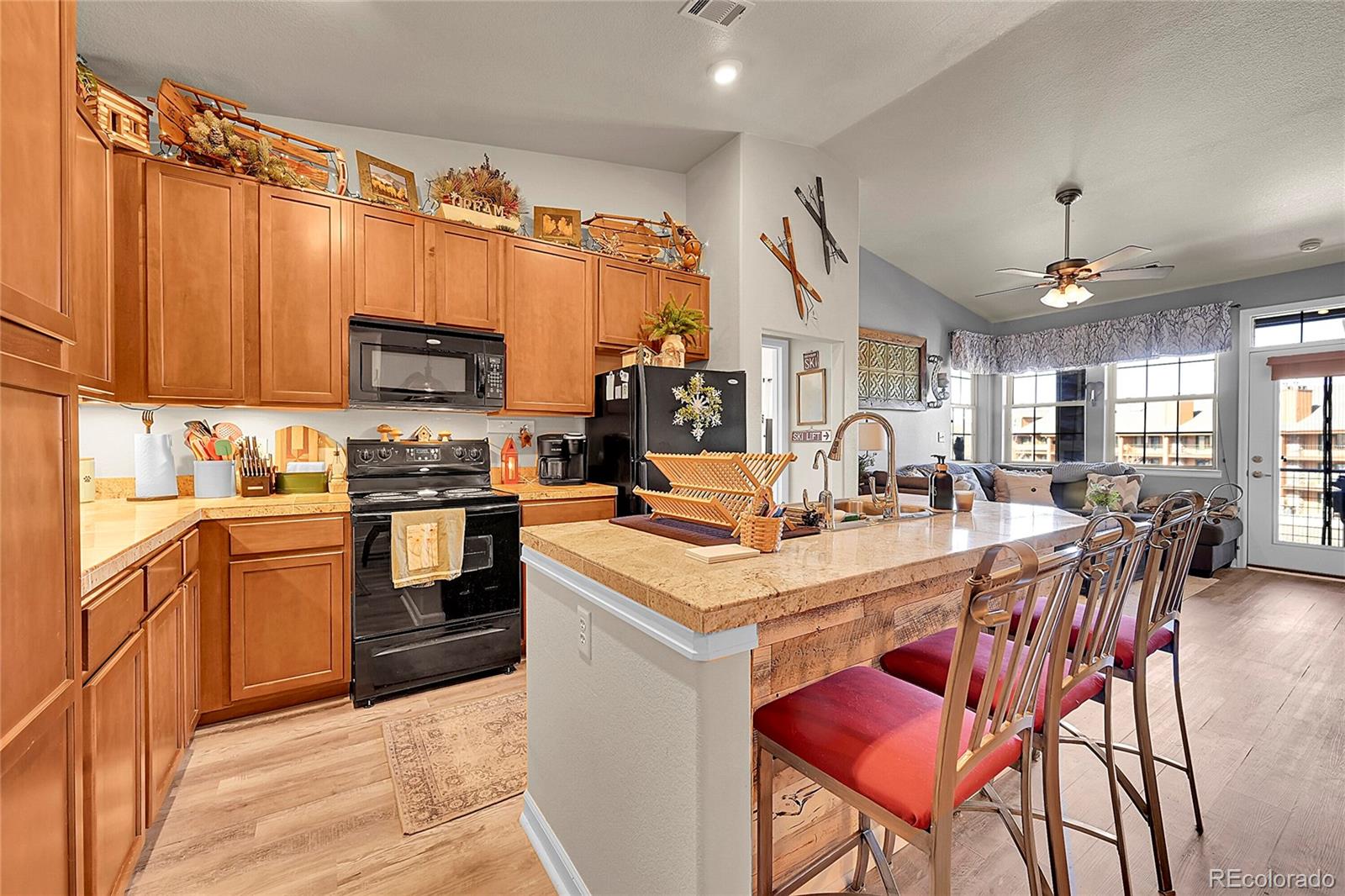 150 Village Road, Unit A302 Granby, CO 80446 - Photo 10 of 50 a kitchen with stainless steel appliances kitchen island granite countertop a sink and cabinets