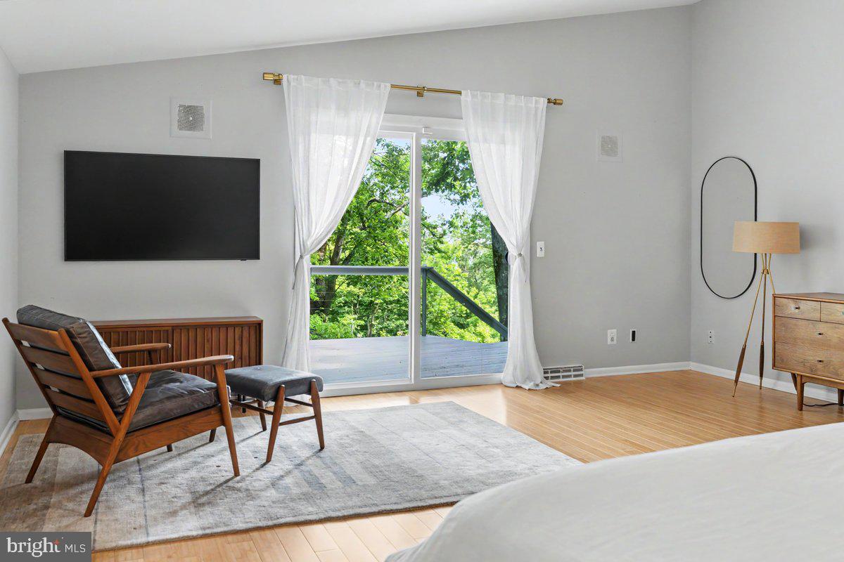 13 High Road New Hope, PA 18938 - Photo 26 of 56 a living room with a flat screen tv and a large window