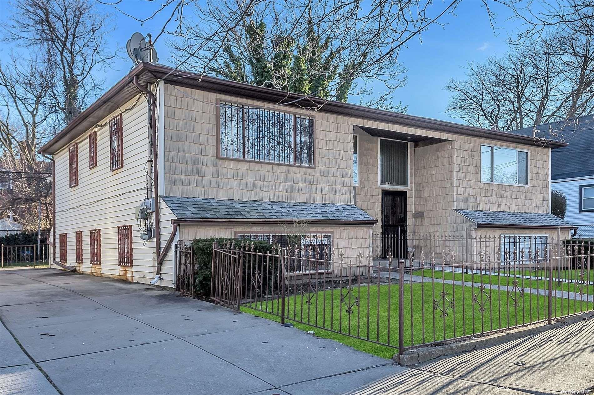 165-28 144th Drive Queens, NY 11434 - Photo 3 of 25 a view of house with a yard