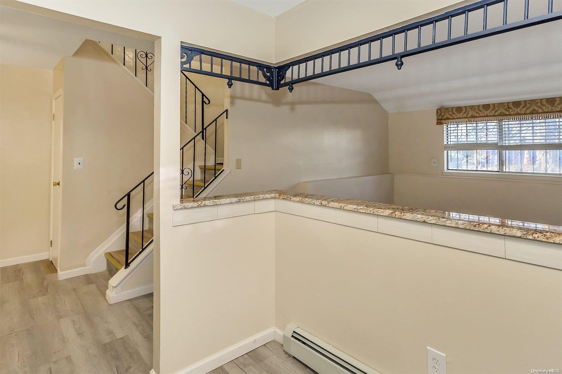 165-28 144th Drive Queens, NY 11434 - Photo 8 of 25 a view of a room with racks on the walls