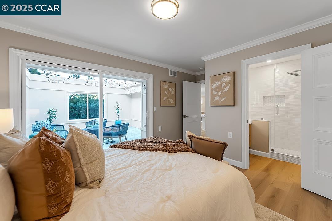 1180 Running Springs Road, Unit 4 Walnut Creek, CA 94595 - Photo 17 of 24 a bedroom with a bed and a large window