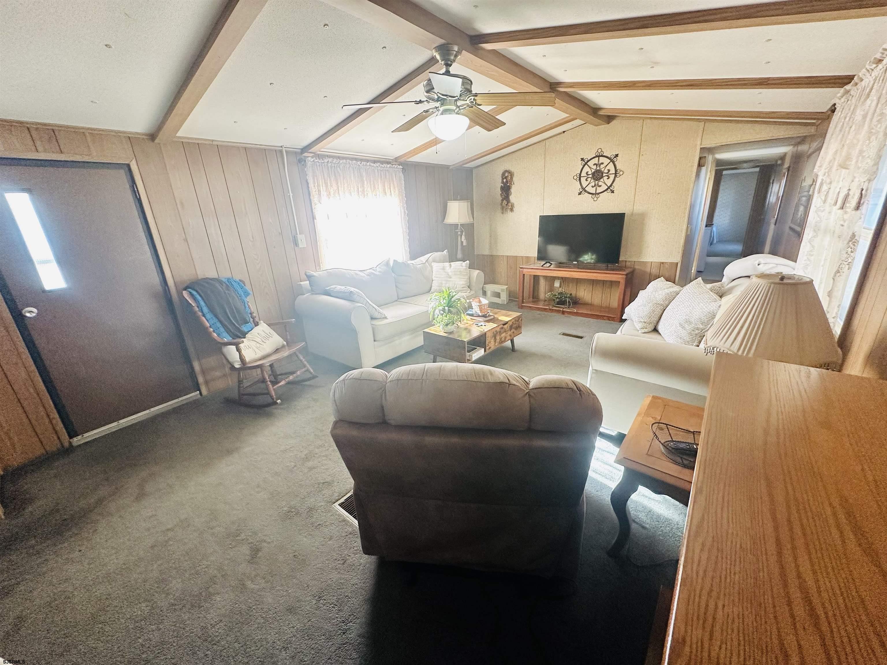498 Pilgrim Way South Buena, NJ 08310 - Photo 10 of 28 a living room with furniture and a flat screen tv