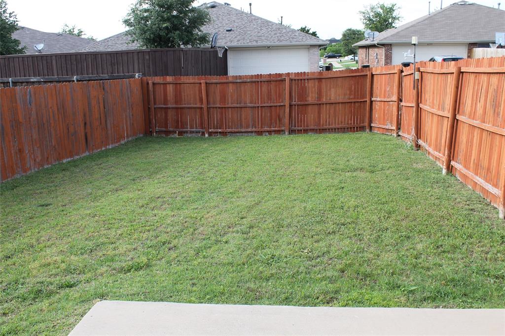 4188 Cherry Ridge Drive Frisco, TX 75033 - Photo 24 of 25 a view of a backyard with wooden fence