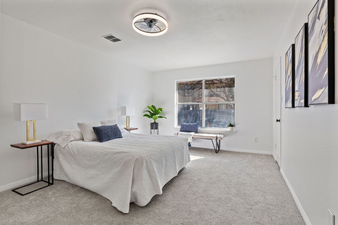 2127 Redwing Way Round Rock, TX 78664 - Photo 12 of 33 1st floor Bedroom featuring light colored carpet and baseboards