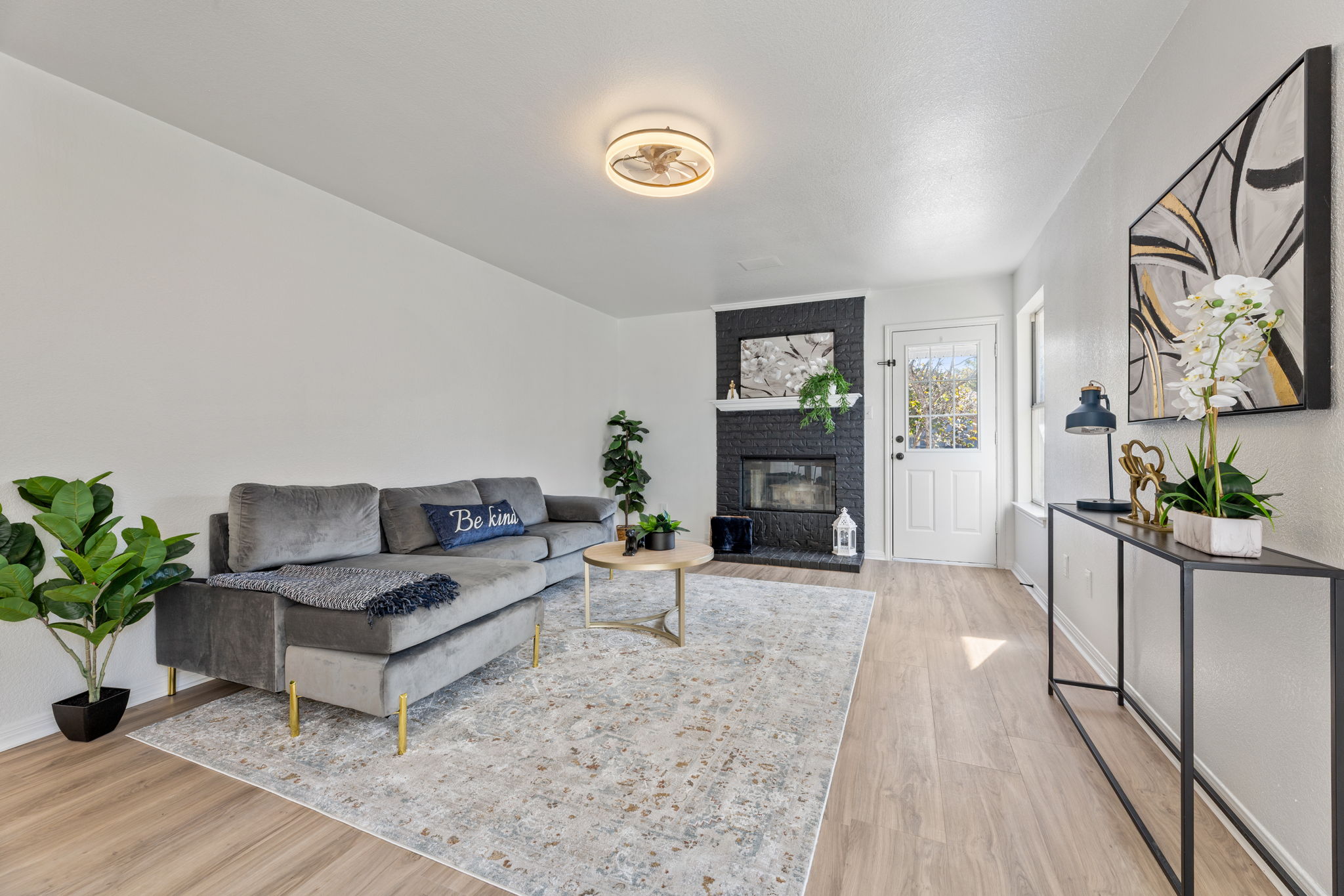 2127 Redwing Way Round Rock, TX 78664 - Photo 2 of 33 a living room with furniture and a potted plant