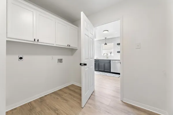 a view of a kitchen with wooden floor