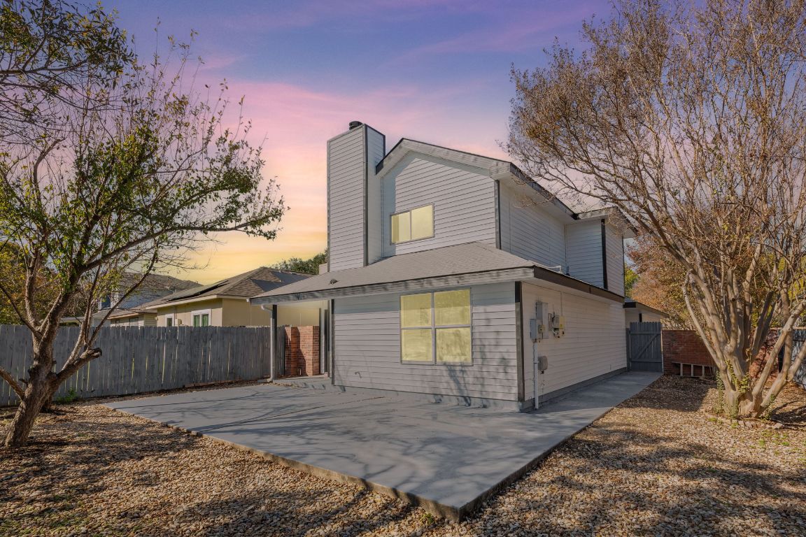 2127 Redwing Way Round Rock, TX 78664 - Photo 29 of 33 View of back of house featuring a chimney, and a patio area