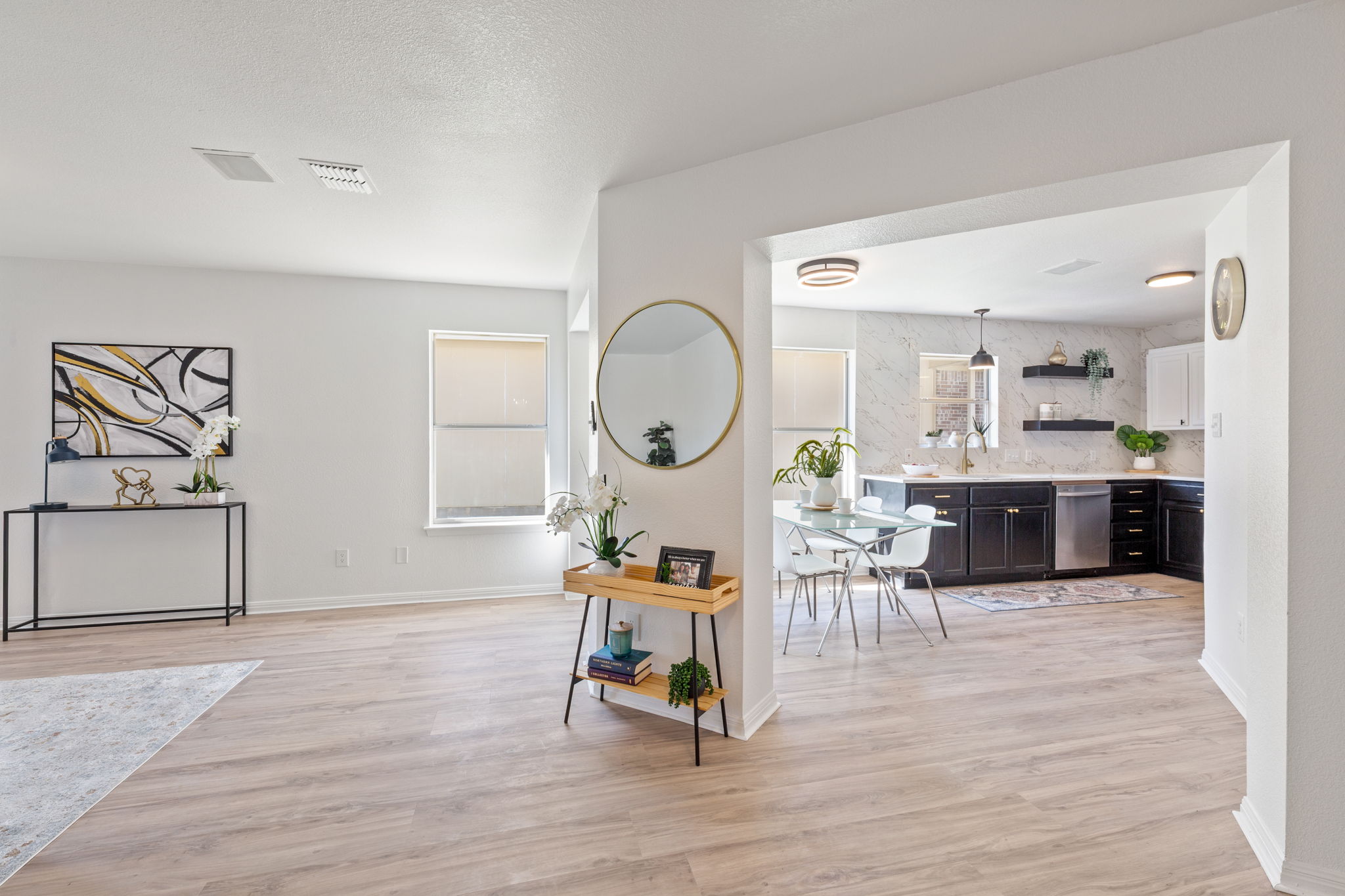 2127 Redwing Way Round Rock, TX 78664 - Photo 3 of 33 a living room with furniture a wooden floor and a large window