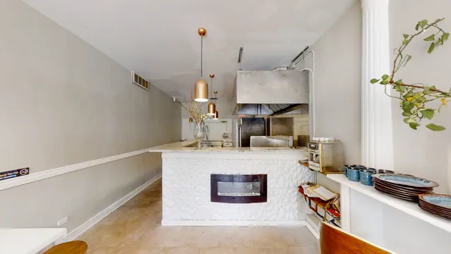 a kitchen with a sink a stove and a refrigerator