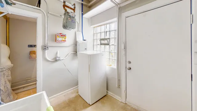 a bathroom with a sink mirror and toilet