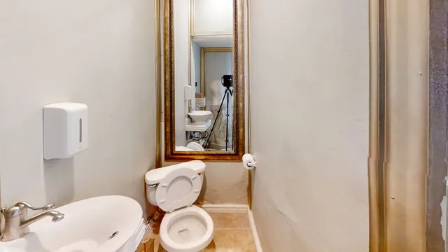 a front view of house with outdoor space and swimming pool