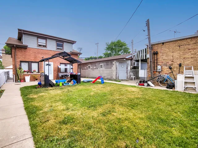 a living room with furniture and a dining table with wooden floor