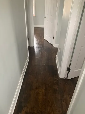 a view of hallway with window and stairs