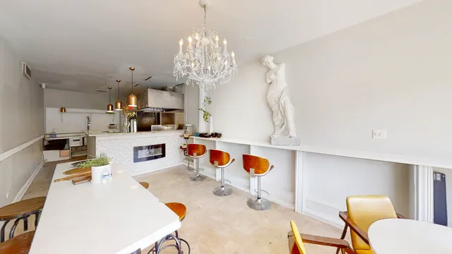 a view of kitchen and dining area with furniture