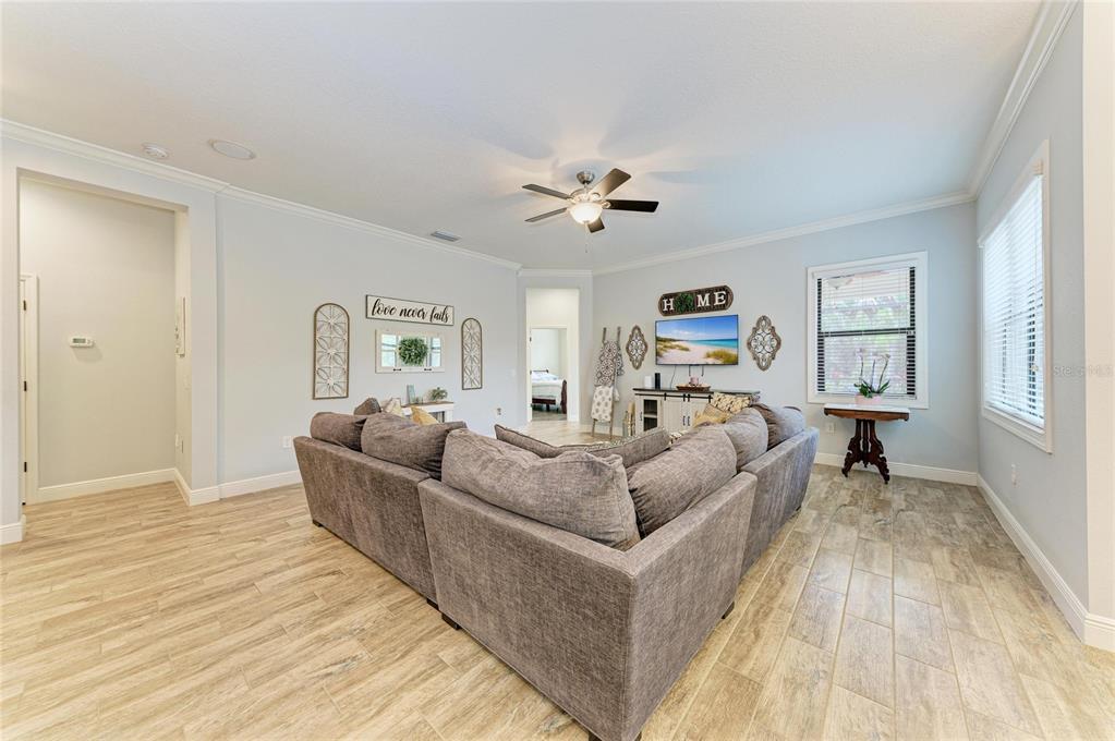 12642 Harney Street Venice, FL 34293 - Photo 19 of 85 a living room with furniture and a wooden floor