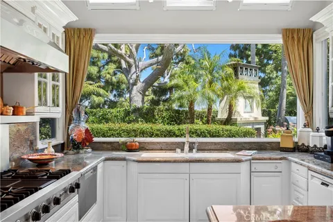 a kitchen with a large window and sink