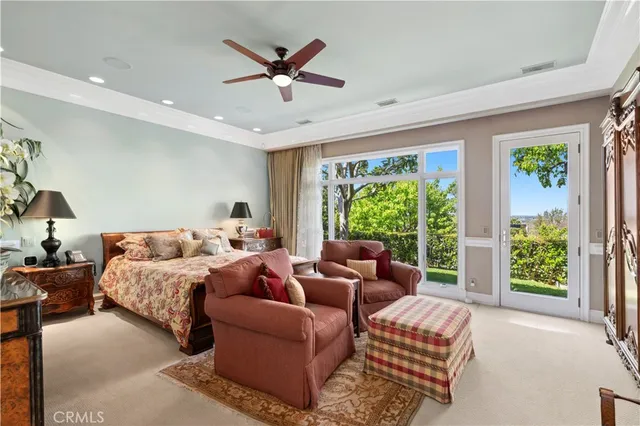 a bed room with bed and a large window