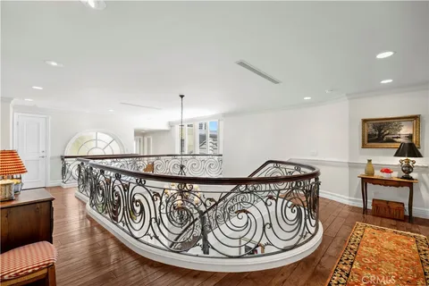 a view of a hallway with furniture