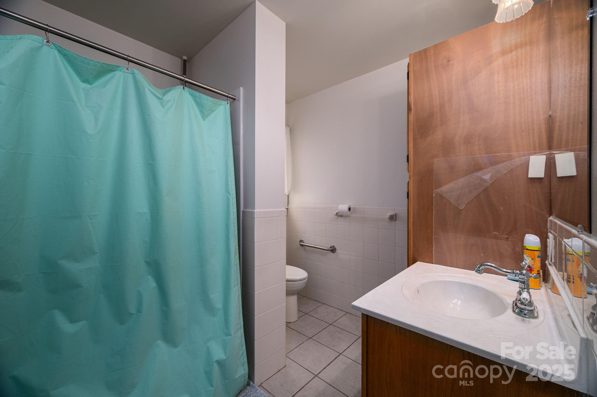 1544 Kings Road Shelby, NC 28150 - Photo 13 of 25 a bathroom with a sink a toilet and shower