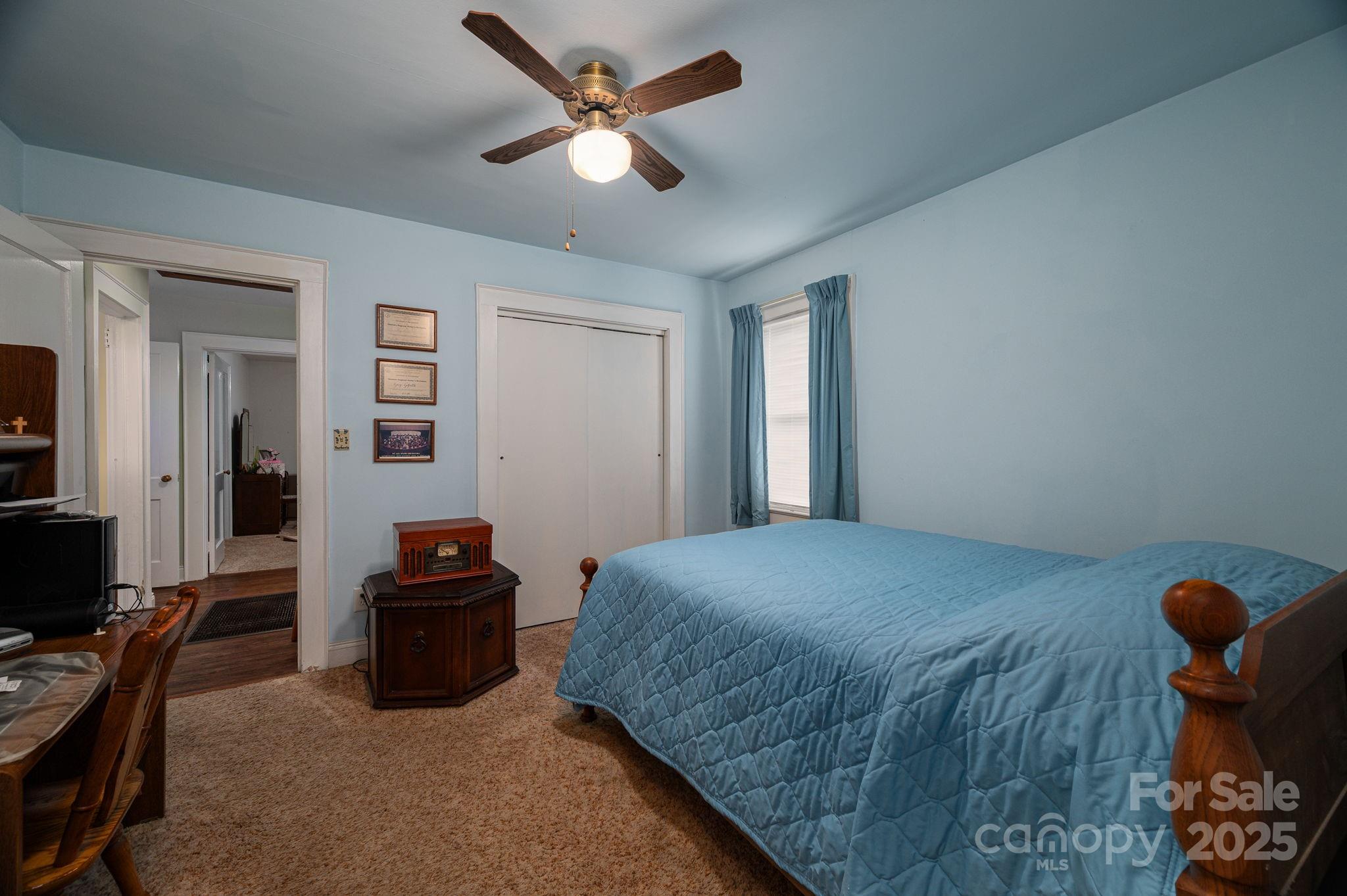 1544 Kings Road Shelby, NC 28150 - Photo 14 of 25 a bedroom with a bed and a chandelier