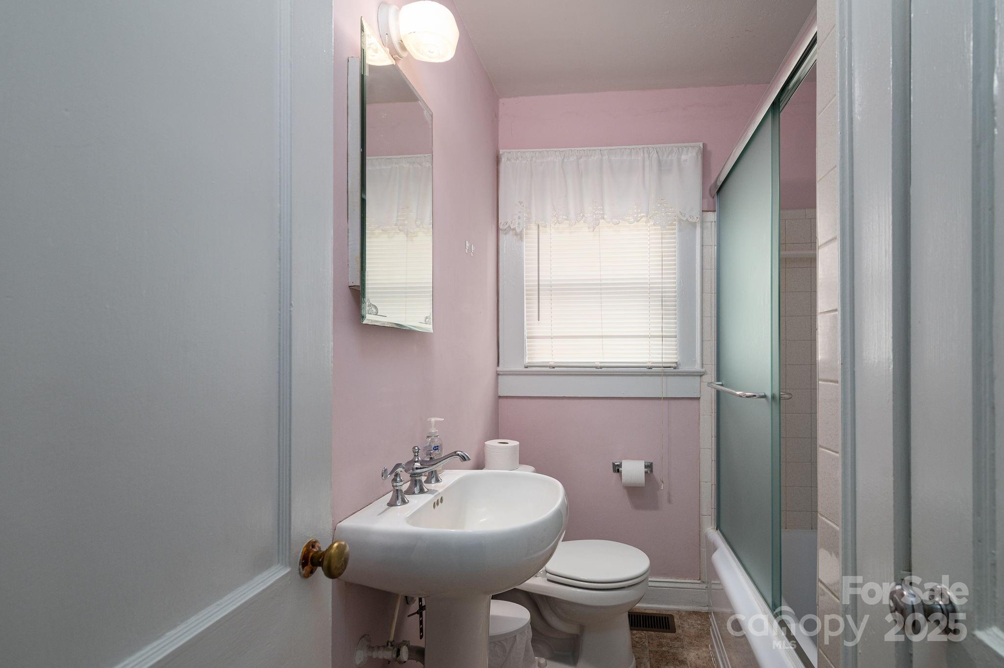 1544 Kings Road Shelby, NC 28150 - Photo 16 of 25 a bathroom with a sink toilet and a mirror