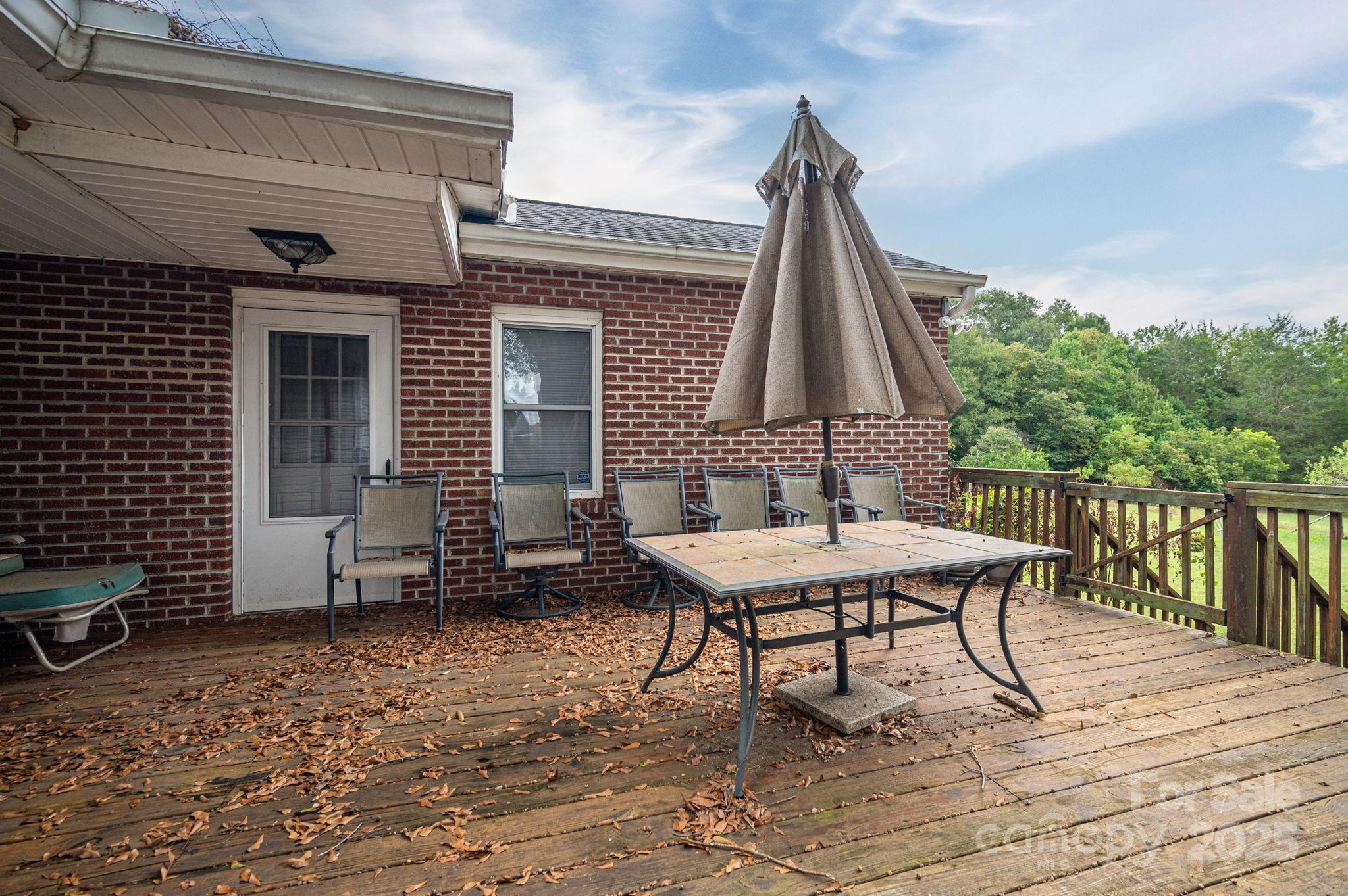 1544 Kings Road Shelby, NC 28150 - Photo 9 of 25 a view of a patio with a table and chairs