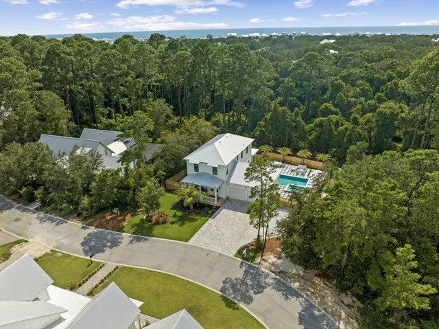 a kitchen with stainless steel appliances a stove a microwave and white cabinets