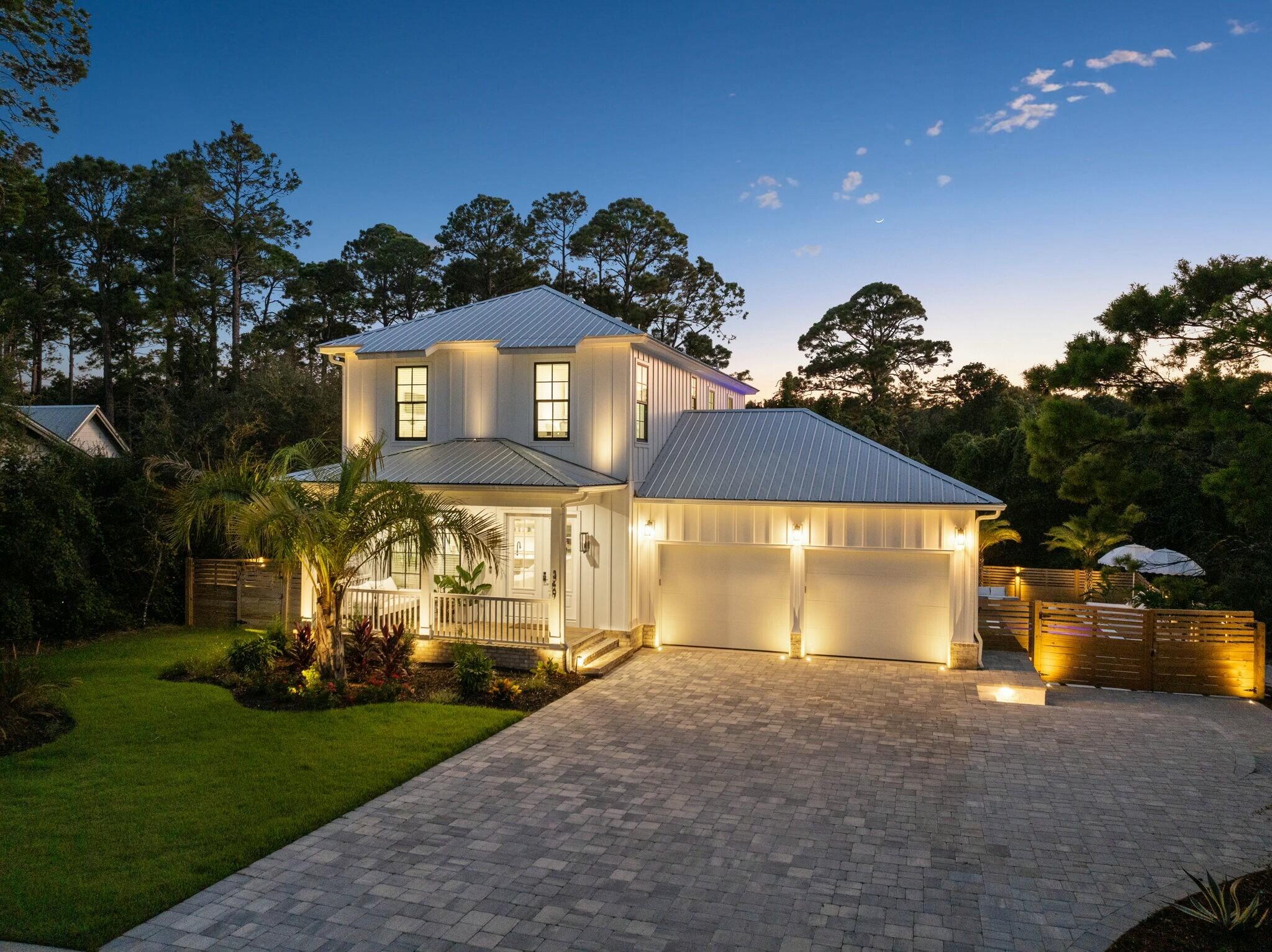349 Seabreeze Blvd Inlet Beach Inlet Beach, FL 32461 - Photo 2 of 74 a front view of a house with a yard and garage