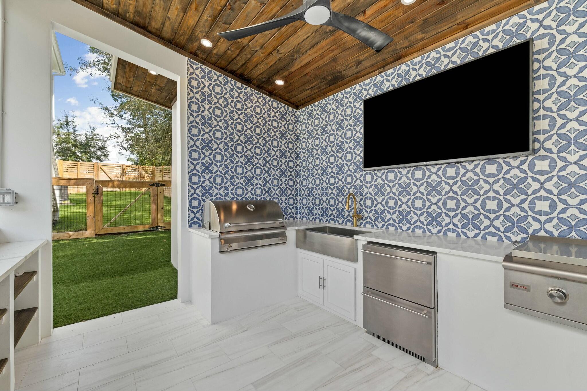349 Seabreeze Blvd Inlet Beach Inlet Beach, FL 32461 - Photo 30 of 74 a living room with a flat screen tv and a fireplace