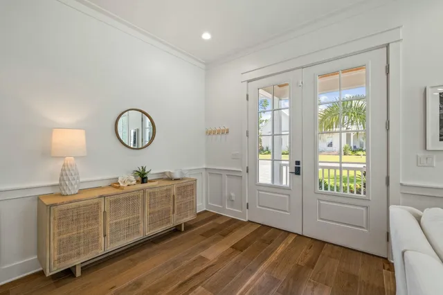 a view of a room with wooden floor and stairs
