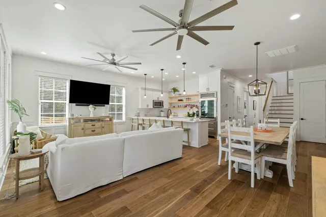 a view of walk in closet with wooden floor washer and dryer