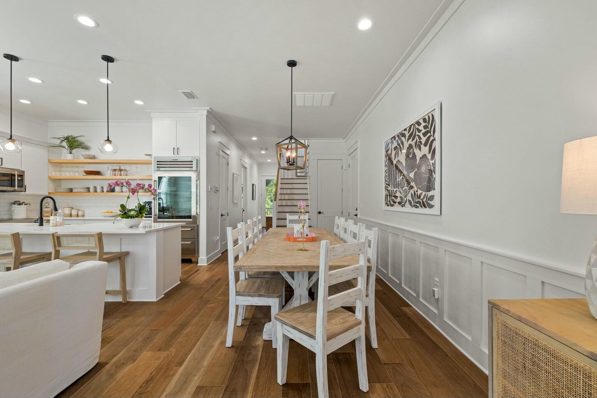 349 Seabreeze Blvd Inlet Beach Inlet Beach, FL 32461 - Photo 36 of 74 a view of a dining room and livingroom with furniture wooden floor kitchen chandelier
