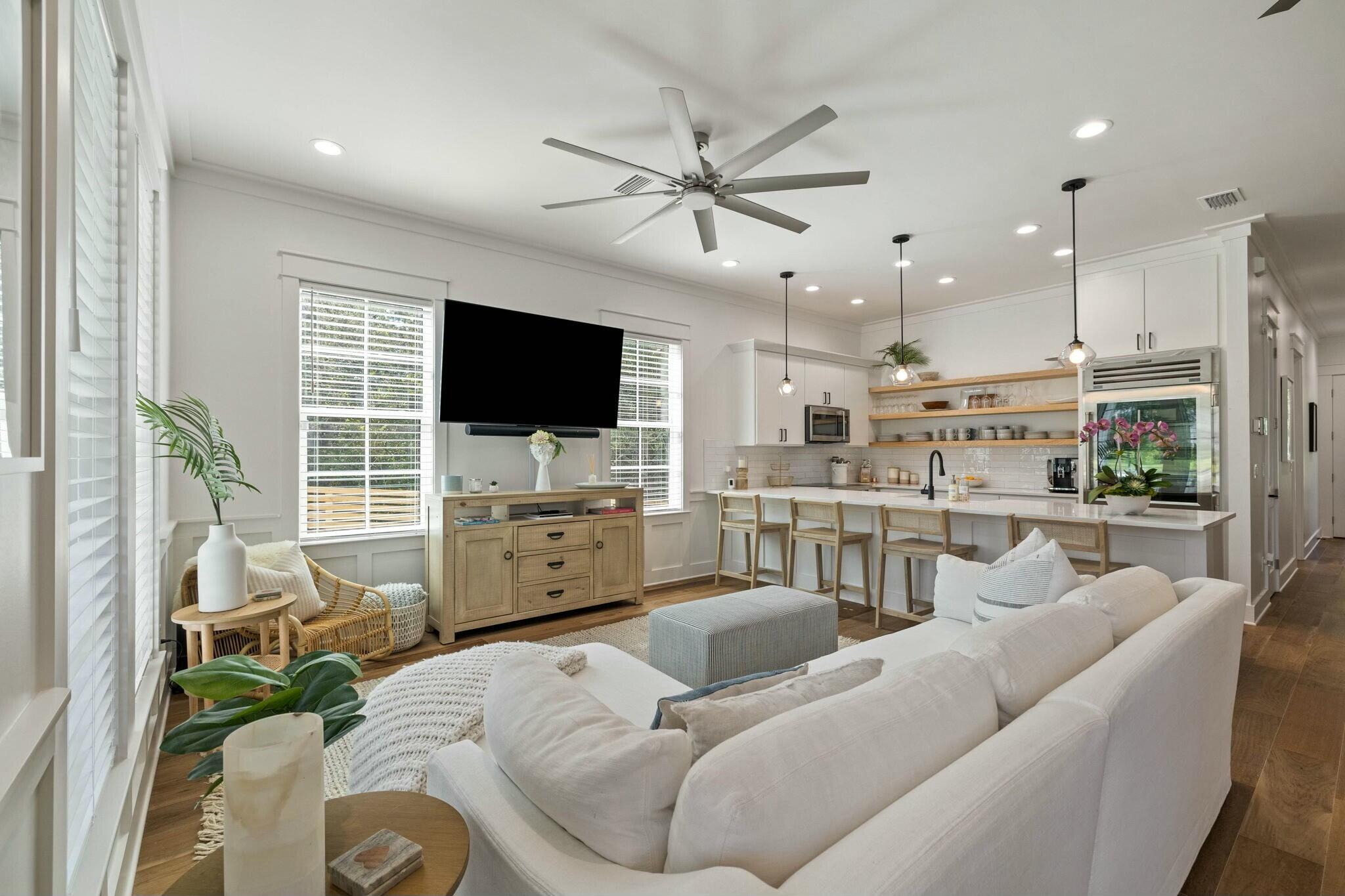 349 Seabreeze Blvd Inlet Beach Inlet Beach, FL 32461 - Photo 40 of 74 a living room with furniture a flat screen tv and kitchen view