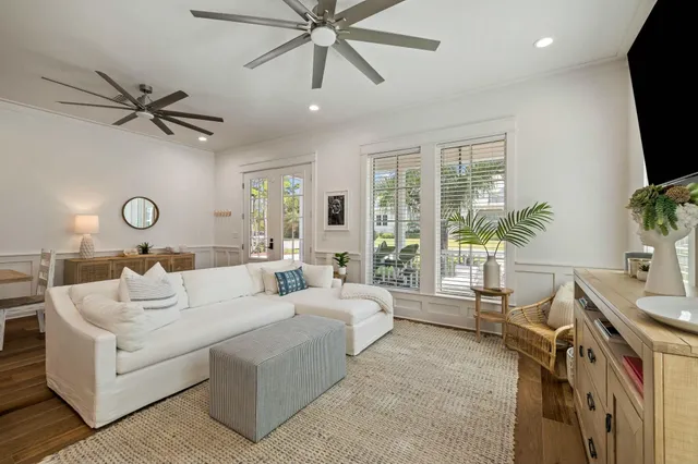 a bedroom with a bed tv and window