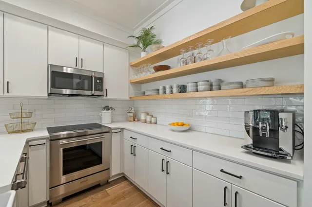 a potted plant sitting on top of a kitchen counter top