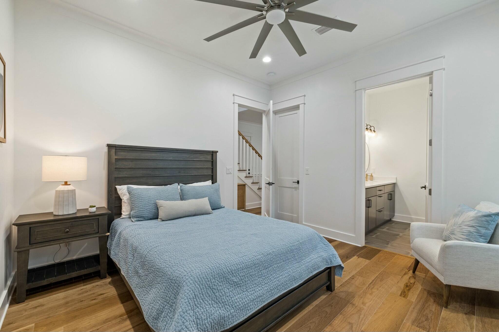 349 Seabreeze Blvd Inlet Beach Inlet Beach, FL 32461 - Photo 49 of 74 a bedroom with a bed and a chandelier