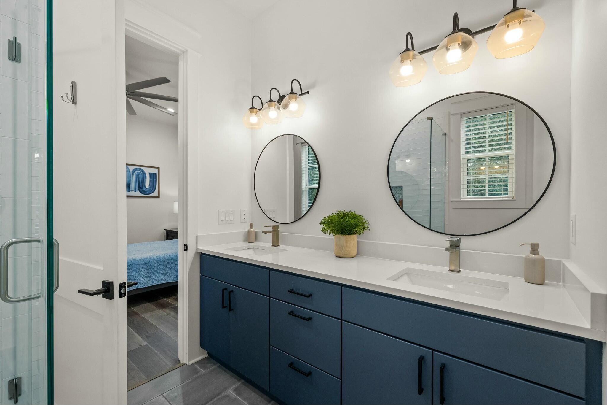 349 Seabreeze Blvd Inlet Beach Inlet Beach, FL 32461 - Photo 50 of 74 a bathroom with a double vanity sink and a mirror
