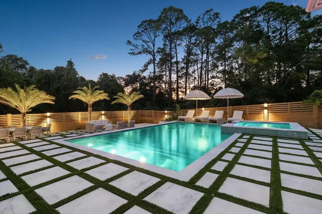 a view of a swimming pool with a patio