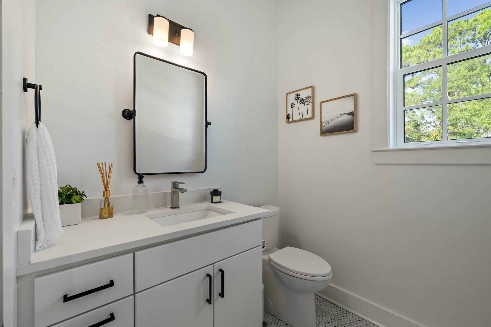 349 Seabreeze Blvd Inlet Beach Inlet Beach, FL 32461 - Photo 52 of 74 a bathroom with a toilet sink and mirror