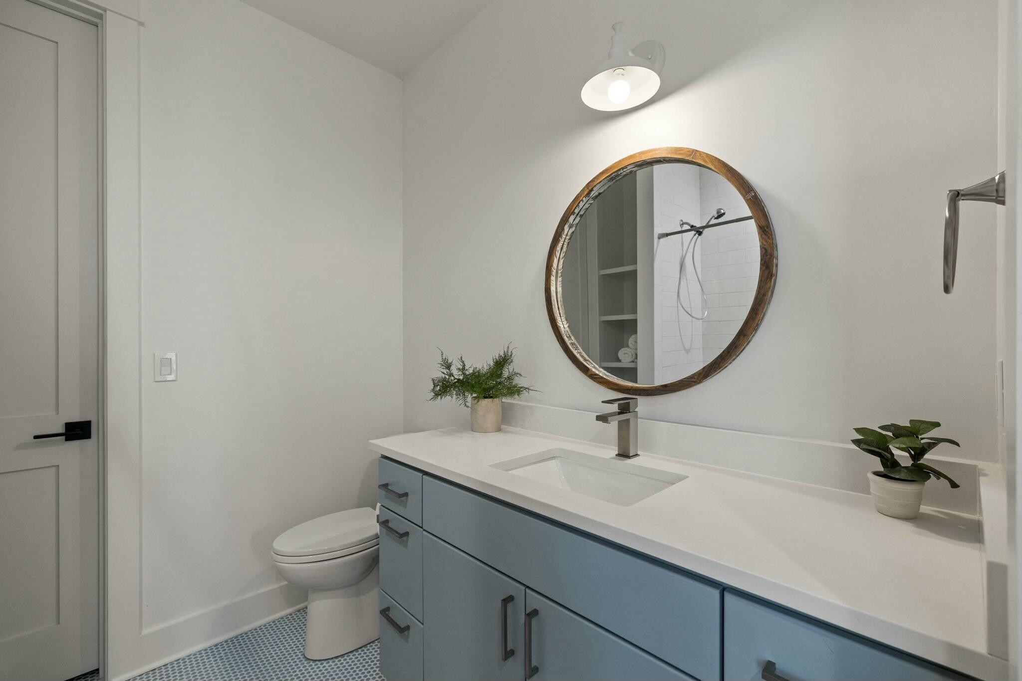 349 Seabreeze Blvd Inlet Beach Inlet Beach, FL 32461 - Photo 68 of 74 a bathroom with a sink a mirror and a toilet